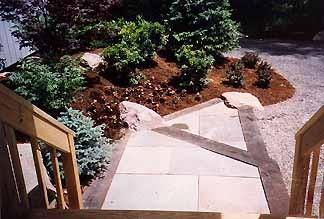 Unfinished hillside with bare dirt and no defined pathway at a Pocono Mountains property