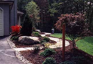 Residential property featuring integrated hardscape elements