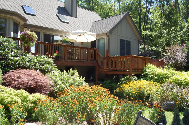 Formal garden beds with boxwood borders and accent plantings