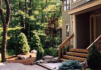 Foundation plantings framing a Pocono Mountains home